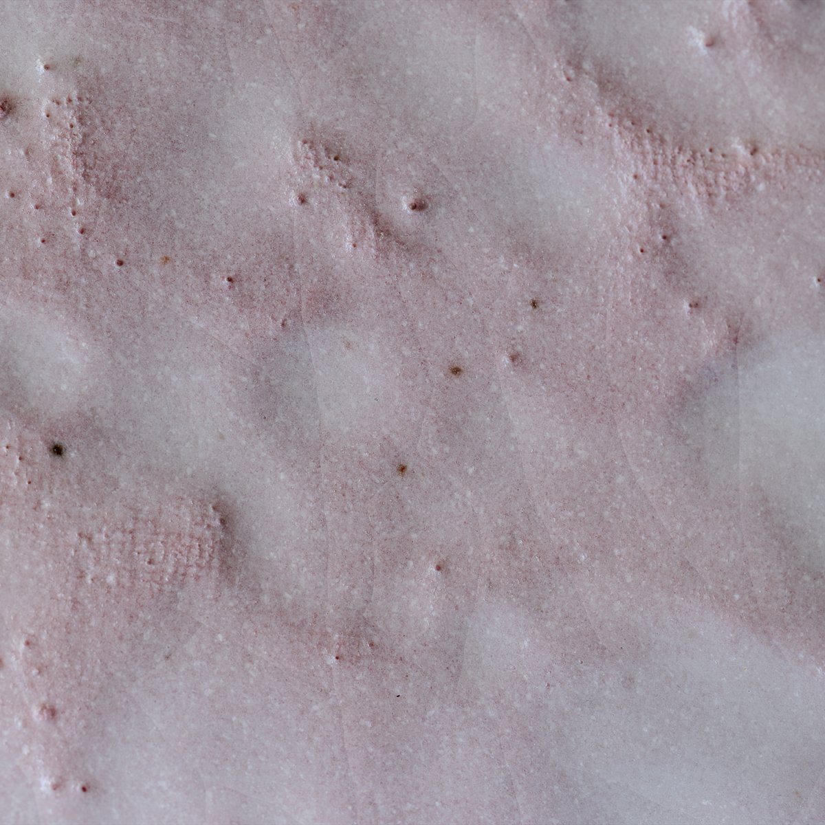 The surface of pink Shino glaze